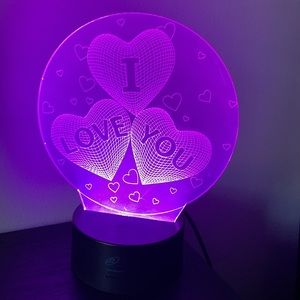 LED “I love you” light , switches between colors. Can stay on one color as well.
